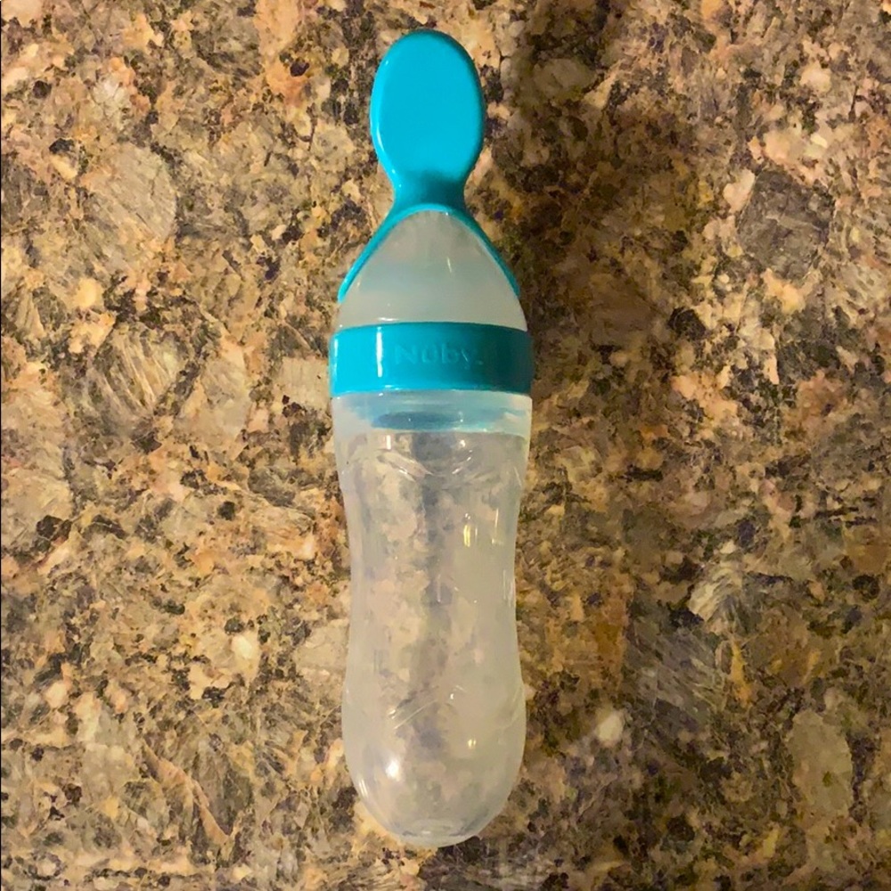 Nuby squeeze baby food spoon and holder in one.